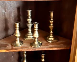 Lots of beautiful antique brass candle sticks