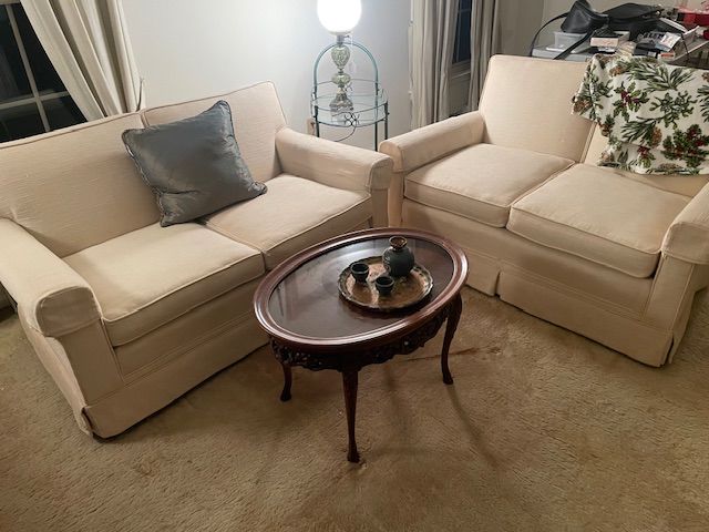 Two white love seats 