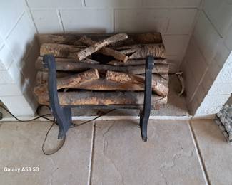 The fireplace logs turn on , but need TLC  to operate correctly $100