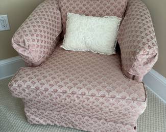 Upholstered pink swivel chair