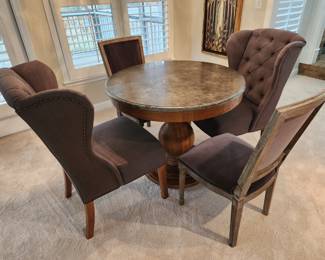 Arhaus Chairs in this picture but unsure of table. TWO CHAIRS SOLD BUT TABLE AND TWO WINGBACK CHAIRS DID NOT SALE. 