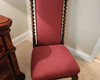 Reminds us of an old Church Chair.  Chair is very low to the floor.  Beautiful Chair!
