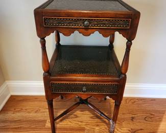 Table has damage to one (possibly two) of the legs.