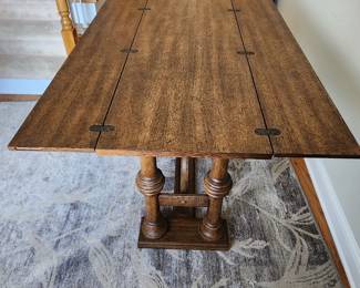  This table has two drop down sides.  Beautiful piece for an entry table.