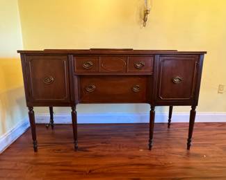 This Hepplewhite style buffet is a beauty.  There is some interior damage from a leak but it can be refinished.