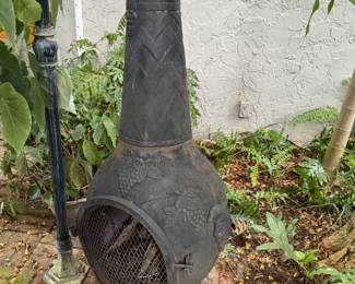 Really cool outdoor cast iron wood burning chiminea/ fireplace.