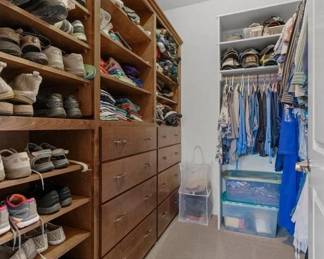 A closet full of great Men's Clothes and some Women's Clothes. 