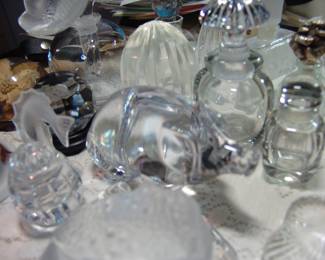 Lalique, Waterford, and other perfume bottles and paper weights. 