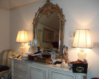 Dresser with pair lamps and misc dresser items. 