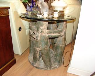 Art figure with glass table. 