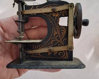 Working ancient handheld sewing  machine $35