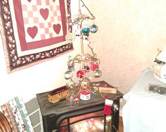 Quilt on wall , black fireplace $60