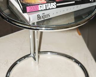 There are three of these glass covered Zuri Modern Aileen accent tables available