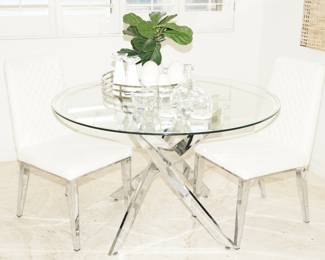Glass topped table with crossed chrome base