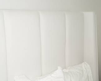 Paneled leather wrapped high back queen size bed frame