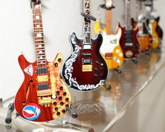 There are 7 of these miniature Grateful Dead guitars available