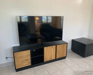 Samsung 65" smart TV, manufactured in 2021, and Walker Edison console