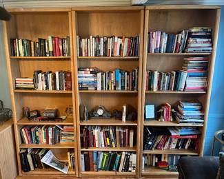 Family Room-Main Floor: Three adjustable five-shelf bookcases are individually priced. Each one measures 31" wide x 10" deep x 84" tall. (There is one extra shelf for each bookcase as well.) The books are just a sample of the many books located throughout the house. The small decorative items and bookends are also for sale.