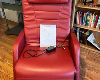 Family Room-Main Floor: This like-new red "Powered Zero Gravity Chair" has an electric remote (see next photo) and its original manual.