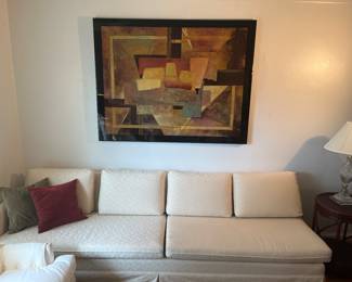 Living Room: This is one long (8' 7") mid-century sofa with two separate bench cushions and four back pillows.  Its upholstery matches the sofa previously shown.  A closer photo of the abstract art follows.