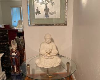 Living Room: This 35" round glass cocktail table with gold gilt legs matches the separately priced console table previously shown. The electric Buddha fountain is made of a composite material (it works!). Hanging on the wall is an original vintage floral still life watercolor on silver leaf by Chi Chang Hou which measures 30" x 34" with its mirrored frame.