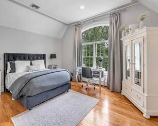 White armoire, dresser, black tufted bed, pair of nightstands ( dressing table, chair, lamps not for sale) 