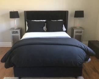 Black tufted bed