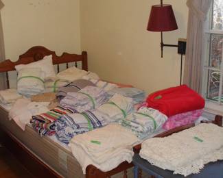 Full size bed with mattress and box spring.