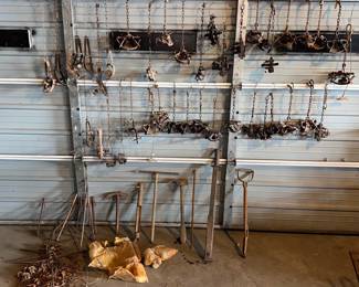 Over 40 leg hold traps (most are Minnesota Trapline brand), lots of trapping tools, catch stick, animal cages