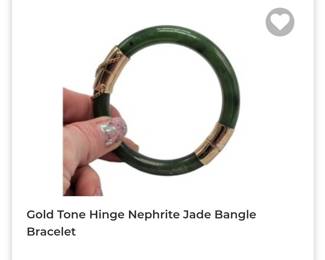 Gold tone hinged nephrite jade bangle bracelet