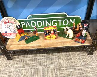 Cast-iron banks and train station metal sign