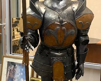Life-size knight in shining armor. Breast-plate opens to reveal bar/bottle storage.