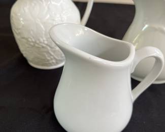 3 white pitchers