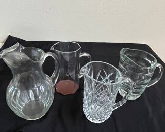 Collection of glass and crystal pitchers