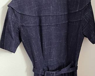 A large lot of vintage dresses and wool skirts