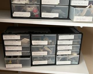 Two multi drawer bins filled with odds and ends