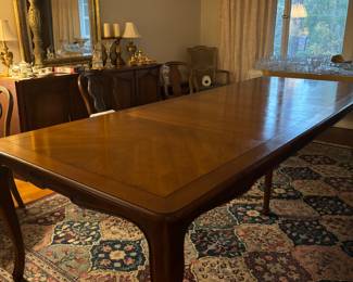 Very nice Henredon 116” banquet style dining table with 3 removable 16” leaves.
Has 8 chairs, matching large china cabinet, and large buffet.