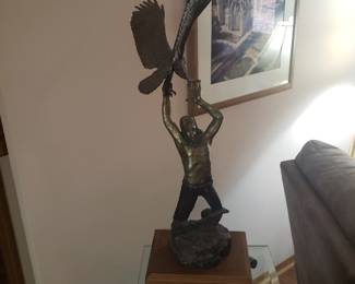 Signed 32" tall bronze on a wood stand ..total height of 37"