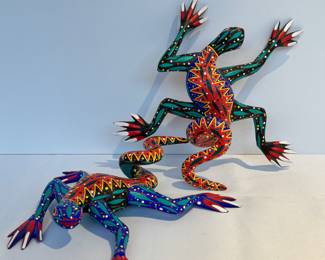 Pair of Arsenio Morales Oaxaca Mexico Wooden Hand Painted Lizards. 

Such colorful designs! Each measuring about 8 inches long. 