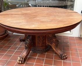 Vintage Round Claw Foot Dining Room Table with exceptional carved details. Unfortunately there is some damage and wear to some of the carved details. It looks like a canine family member might have chewed the base in some areas.

Measures 29 inches tall and 60 inches in diameter. 