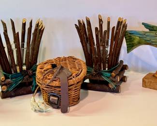Fun Cabin Themed Decorative Items including of rustic style candle holders measuring six inches  tall, miniature fly fishing basket, hand crafted walking fish by Gay Foltz and more. The bear figurine has some wear to the finish. 