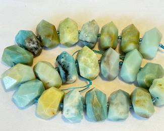 Strand of Cloudy Amazoni Beads, 18x25m. 

Strand measures about 15.75 inches long. 