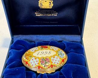 Halcyon Days Oval A Year to Remember 1998 Enamel Trinket Box, measuring about 2 1/18" x 1 3/4". Comes with the box 
