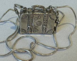 Silver Luggage Locket Necklace, measuring 22 inches long

Not marked. 