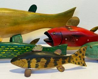Artisan Decorative Wooden and Metal Fish Wall Hangings, measuring between 7.25 inches to 17 inches long

Three are signed by the artist. Items in used condition with some wear including paint loss. 
