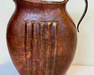 Santa Clara Del Cobre, Mexico Copper Pitcher. 

A very nice, decorative hand hammered arts and crafts style pitcher. Measuring about 9.5 inches tall. 
