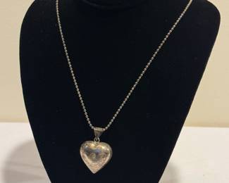 Sterling Silver Heart Pendant Necklace on beaded style chain, measuring 28" long. Item in vintage condition with some wear and needs to be polished. 