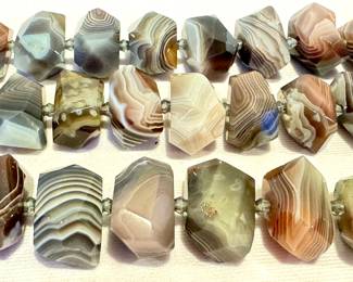 (3) Strands of Agate Beads with each strand measuring about 15.5 inches long

These beads are gorgeous examples of nature's beauty! 