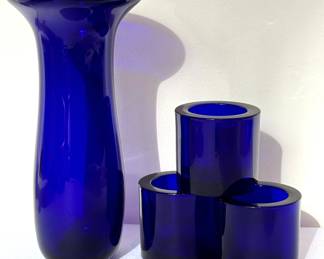 Decorative Hand Blown Cobalt Blue Vase and Votive Holders. The vase measures 8.5 inches tall and the votive holders are 2.5 inches tall. 