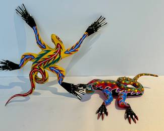 Pair of Oaxaca Mexico Wooden Hand Painted Lizards. Each measuring about eight inches long. 

